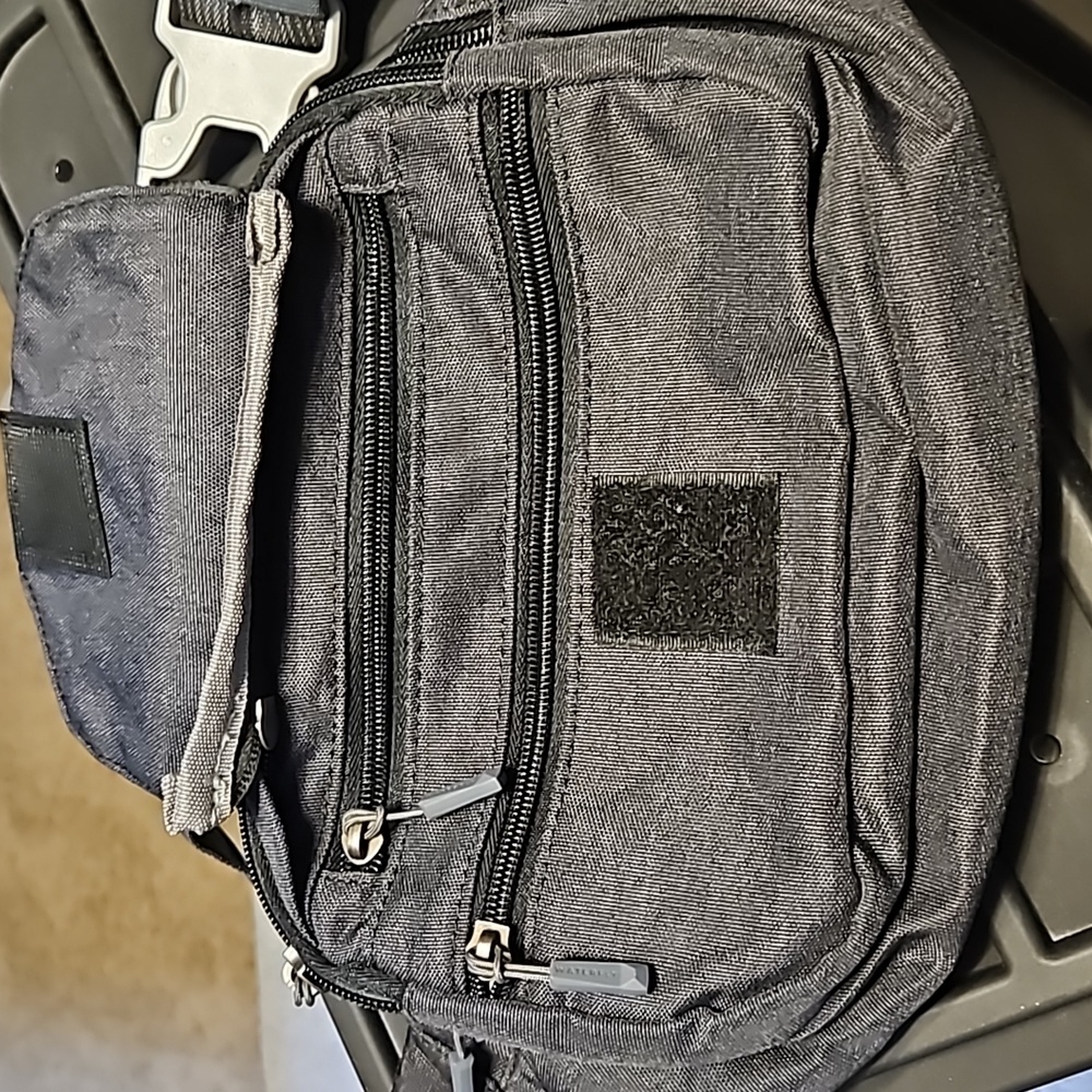 Waterfront Multiple pocket fanny pack in charcoal black. - Picture 3 of 6